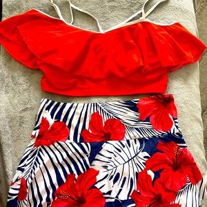 2 piece swim suit, top w/ruffle, bottoms are shorts w/ skirt overlay